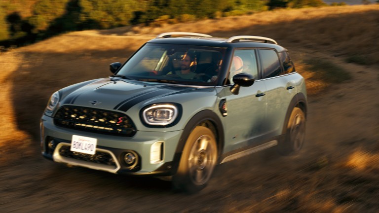 MINI Countryman drives up a mountain road with All4 All-Wheel Drive